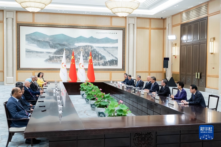 习近平会见亚洲奥林匹克理事会代理主席辛格